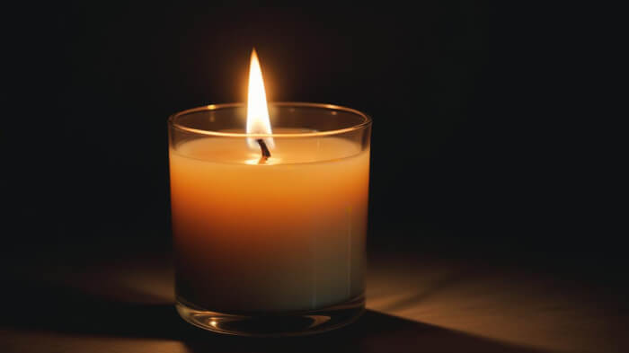 A product image of a scented candle in the night photography theme.  