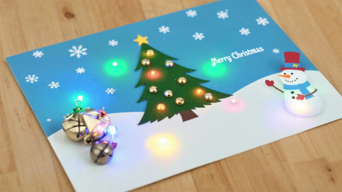 Christmas cards with LED lights, jingle bells, and pull-tab snowman.