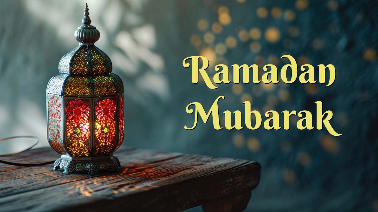 An image of a traditional lantern on a table with “Ramadan Mubarak” wish written over it.